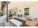 Covered patio with dining and seating area, ceiling fan, and classic brick wall accents at 546 W Cambridge Ave, Phoenix, AZ 85003