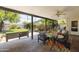 Outdoor patio featuring a swing, seating, ceiling fan, and a view of the manicured backyard at 546 W Cambridge Ave, Phoenix, AZ 85003