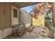 Exterior view of the back entry door with steps, concrete yard, and storage shed in the backyard at 5601 W Missouri Ave # 254, Glendale, AZ 85301