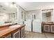Bathroom with double sinks and mirrors, offering style and practicality at 5601 W Missouri Ave # 254, Glendale, AZ 85301