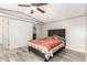 Bright bedroom with a gray headboard bed and light-colored wood-look flooring at 5601 W Missouri Ave # 254, Glendale, AZ 85301