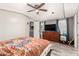 Comfortable bedroom with wood floors, large window, and ceiling fan at 5601 W Missouri Ave # 254, Glendale, AZ 85301