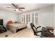 Well-lit bedroom with a ceiling fan and window shutters offering a peaceful retreat at 5601 W Missouri Ave # 254, Glendale, AZ 85301