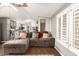 Bright living room with wood floors and a comfortable sectional sofa at 5601 W Missouri Ave # 254, Glendale, AZ 85301