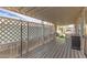 Covered patio with white lattice, wood flooring, and room for seating offers a relaxed outdoor living space at 5601 W Missouri Ave # 254, Glendale, AZ 85301