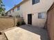 A small fenced-in backyard features a small concrete patio and stucco walls at 7126 N 19Th Ave # 108, Phoenix, AZ 85021