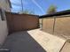 A small backyard includes a small concrete patio area and chainlink fencing at 7126 N 19Th Ave # 108, Phoenix, AZ 85021