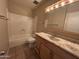 A bathroom features a vanity sink, mirror, and standard bathtub with shower head at 7126 N 19Th Ave # 108, Phoenix, AZ 85021