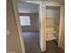 A spacious bedroom with neutral carpet adjoins a closet with adjustable shelving at 7126 N 19Th Ave # 108, Phoenix, AZ 85021
