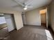 A carpeted bedroom contains a mirrored closet, ceiling fan, and a standard-sized window at 7126 N 19Th Ave # 108, Phoenix, AZ 85021