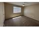 A carpeted bedroom features a standard-sized window, neutral paint, and ceiling fan at 7126 N 19Th Ave # 108, Phoenix, AZ 85021