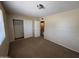 A carpeted bedroom showcases a closet and a standard-sized window for ample natural light at 7126 N 19Th Ave # 108, Phoenix, AZ 85021