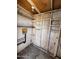 Shed interior showing open framing, plywood walls, and plumbing at 7126 N 19Th Ave # 108, Phoenix, AZ 85021