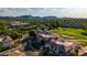 Expansive aerial view of luxury homes with golf course access, set against a backdrop of scenic mountains at 7222 E Gainey Ranch Rd # 140, Scottsdale, AZ 85258