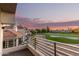 Balcony view of well-manicured golf course and amazing sunset at 7222 E Gainey Ranch Rd # 140, Scottsdale, AZ 85258