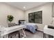 Cozy bedroom with a single bed, a modern desk, and a large window offering ample natural light at 7222 E Gainey Ranch Rd # 140, Scottsdale, AZ 85258