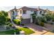 Beautiful townhome with a two-car garage, lush landscaping, and a well-maintained lawn at 7222 E Gainey Ranch Rd # 140, Scottsdale, AZ 85258