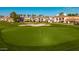 Beautiful view of a pristine green golf course and sand trap, surrounded by luxury homes with red tile roofs at 7222 E Gainey Ranch Rd # 140, Scottsdale, AZ 85258