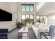 Comfortable living room with large windows overlooking the golf course at 7222 E Gainey Ranch Rd # 140, Scottsdale, AZ 85258