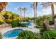 Serene pool and spa area nestled in lush landscaping, offering a private and tranquil retreat at 7222 E Gainey Ranch Rd # 140, Scottsdale, AZ 85258