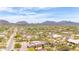 Beautiful aerial shot of desert homes nestled in Arizona with breathtaking views of the surrounding mountains at 8255 E Yearling Rd, Scottsdale, AZ 85255