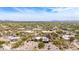 Breathtaking aerial view of a community nestled in the Arizona desert, surrounded by lush greenery and stunning mountain views at 8255 E Yearling Rd, Scottsdale, AZ 85255
