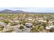 Serene aerial view of a neighborhood in Arizona, surrounded by desert landscape and stunning mountain vistas at 8255 E Yearling Rd, Scottsdale, AZ 85255