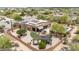 Awe-inspiring aerial view showcasing a luxurious desert home with pool, patio, and solar panels at 8255 E Yearling Rd, Scottsdale, AZ 85255