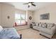 Cozy bedroom area featuring built-in window seat and comfortable sofa for relaxing at 8255 E Yearling Rd, Scottsdale, AZ 85255