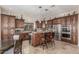 Gourmet kitchen with custom cabinetry, stainless steel appliances, and a center island at 8255 E Yearling Rd, Scottsdale, AZ 85255