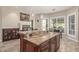 Spacious kitchen island featuring granite countertops and dark wood cabinetry, perfect for entertaining and meal prep at 8255 E Yearling Rd, Scottsdale, AZ 85255