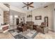 Spacious living room with stone accent wall and comfortable seating arrangement at 8255 E Yearling Rd, Scottsdale, AZ 85255