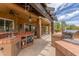Spacious outdoor kitchen with brick accents, featuring a built-in sink, grill, and ample counter space at 8255 E Yearling Rd, Scottsdale, AZ 85255