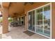 Spacious covered patio with outdoor dining, tile floor, and sliding glass doors at 8255 E Yearling Rd, Scottsdale, AZ 85255