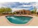 Stunning backyard with a large swimming pool, lounge chairs, and a well-maintained patio area at 8255 E Yearling Rd, Scottsdale, AZ 85255