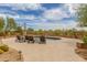 Inviting pool area with lounge chairs, an umbrella, and lush desert landscaping for outdoor relaxation at 8255 E Yearling Rd, Scottsdale, AZ 85255