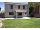 Spacious backyard featuring green grass, a covered patio, and privacy fencing at 8514 S 49Th Dr, Laveen, AZ 85339