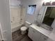 Cozy bathroom featuring a shower-tub combo and a single sink vanity with a mosaic backsplash at 8514 S 49Th Dr, Laveen, AZ 85339