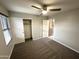 Bedroom showcasing closet with sliding doors, neutral carpet, and a ceiling fan with light at 8514 S 49Th Dr, Laveen, AZ 85339