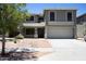 Beautiful two-story home with desert landscaping, a covered porch, and a spacious driveway at 8514 S 49Th Dr, Laveen, AZ 85339