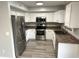 Kitchen featuring stainless steel appliances, white cabinets and stone countertops at 8514 S 49Th Dr, Laveen, AZ 85339