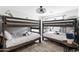 Bedroom featuring bunk beds with neutral bedding at 8714 E Plaza Ave, Scottsdale, AZ 85250