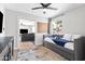 Cozy bedroom with a daybed, ceiling fan, and view into living room at 8714 E Plaza Ave, Scottsdale, AZ 85250