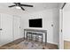Bedroom with a mounted TV and a table with stools at 8714 E Plaza Ave, Scottsdale, AZ 85250