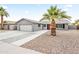 Charming single-story home with a well-maintained front yard and a two-car garage at 8714 E Plaza Ave, Scottsdale, AZ 85250