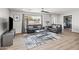 Spacious living room with natural light, a modern rug, and comfortable seating at 8714 E Plaza Ave, Scottsdale, AZ 85250