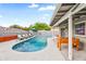 Backyard pool and patio area with lounge chairs, dining table and foosball at 8714 E Plaza Ave, Scottsdale, AZ 85250