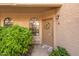 Inviting front door with a decorative wreath and desert landscaping, welcoming guests to this charming home at 930 N Mesa Dr # 1045, Mesa, AZ 85201