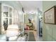 Bright hallway with decorative mirrors and console table enhancing the home's aesthetic appeal at 930 N Mesa Dr # 1045, Mesa, AZ 85201