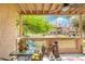 Covered patio with outdoor seating overlooking the lawn and providing a perfect space for relaxation at 930 N Mesa Dr # 1045, Mesa, AZ 85201